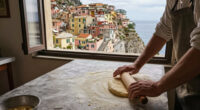 This Cliffside Italian Village Was Named The Happiest Place To Travel In Europe—and It Has Colorful Houses And Pebble Beaches
